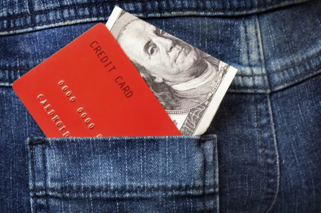 Credit card in pocket money and credit card in back jean pocket
