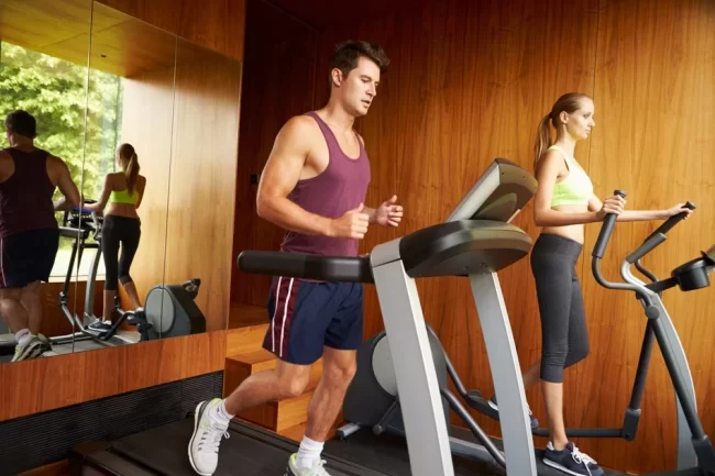 Home-Gym Couple Exercising Together In Home Gym