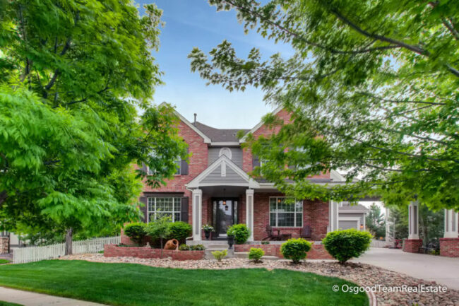 grand front porch with extended columns and portico