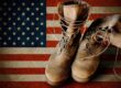US Army boots on sandy american flag background collage
