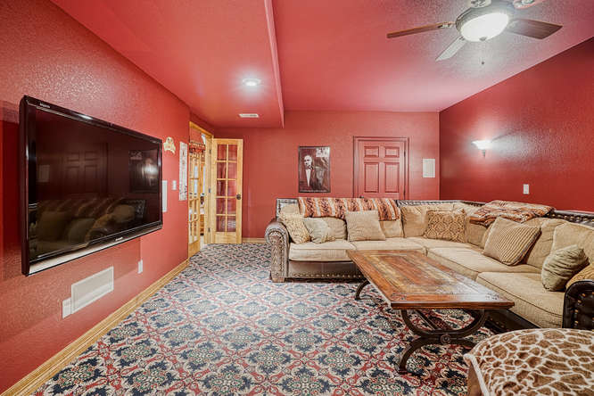 theater room with red walls