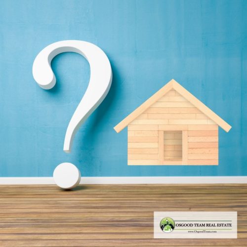 Questions blog question mark next to wood house on blue wall