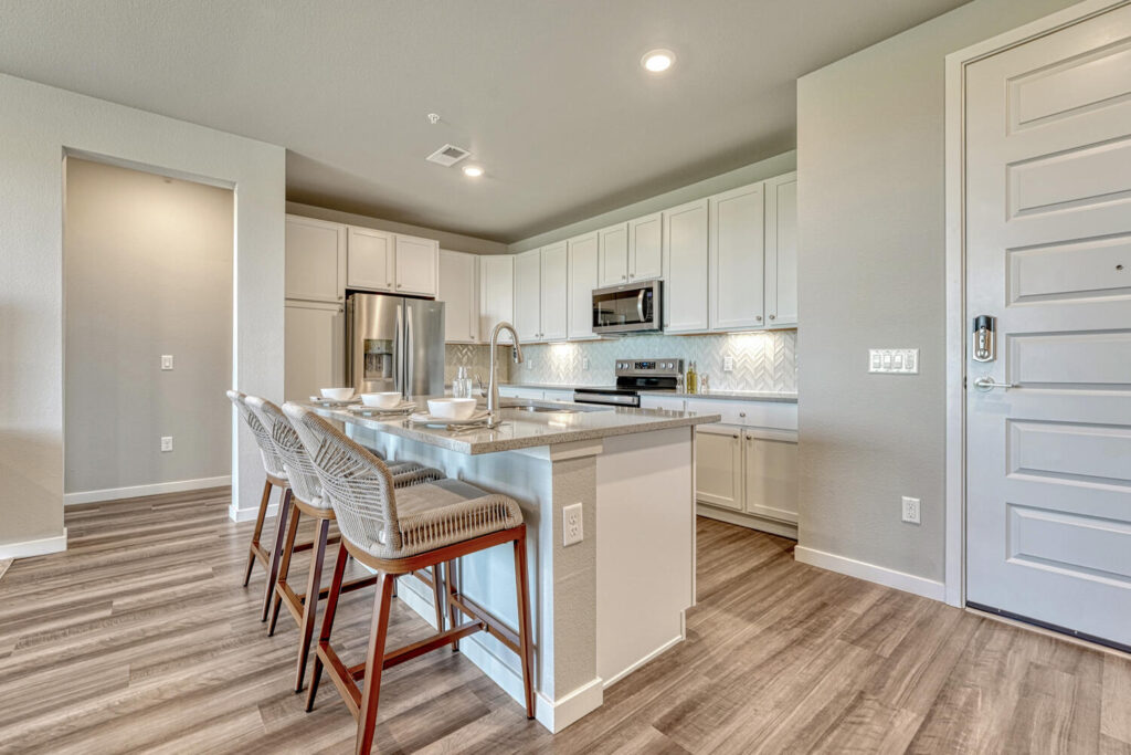 upscale kitchen at trails at westcreek condo hoa in parker center island with seating