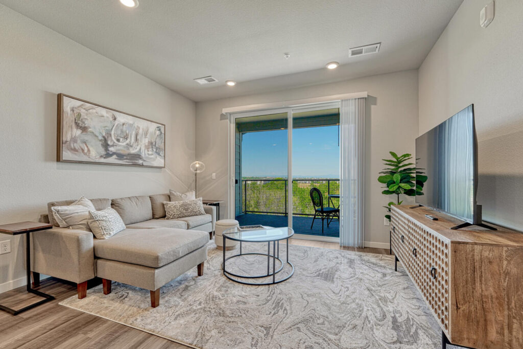 furnished condo for sale in parker living room with mountain view