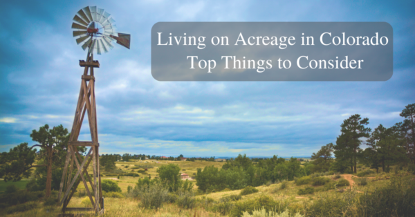 blog cover image of windmill and views of mountains on topic living on acreage in colorado and the things to consider before buying a home