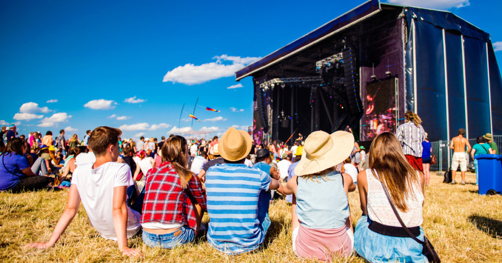 a bunch of outdoor concert goers for a summer concert series