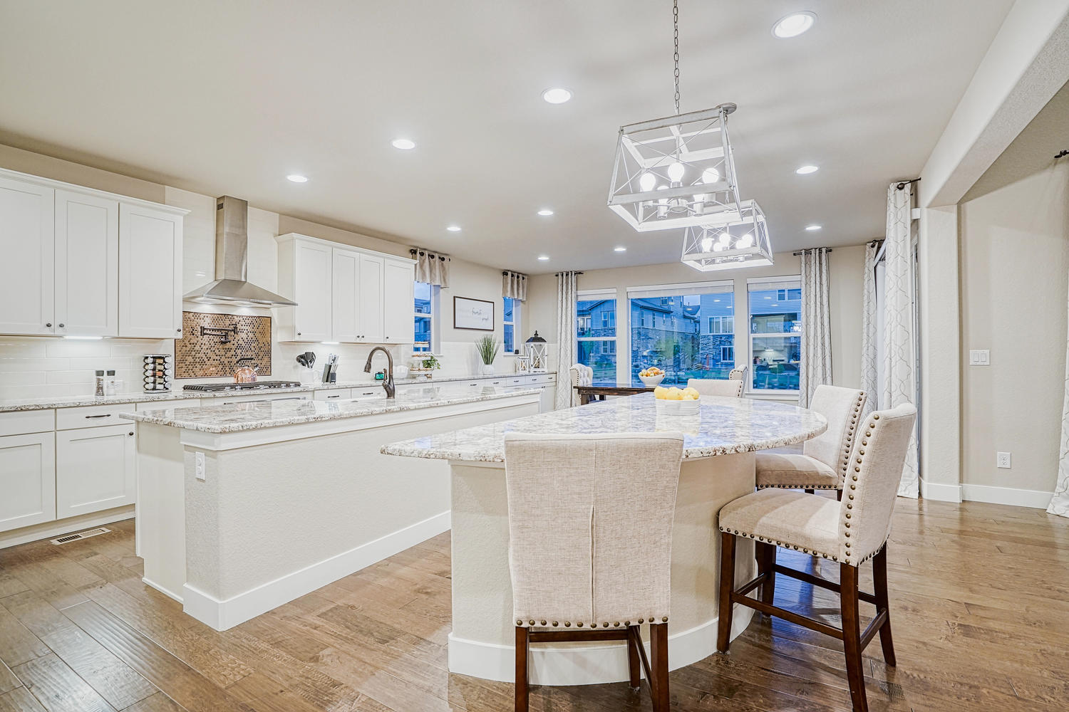 stunning white kitchen with double islands