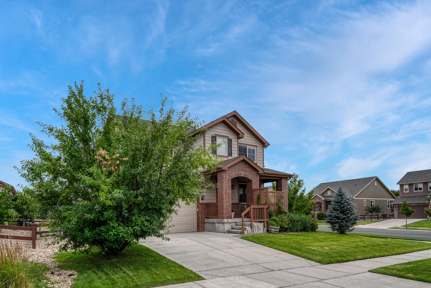 corner lot home with brick entrance