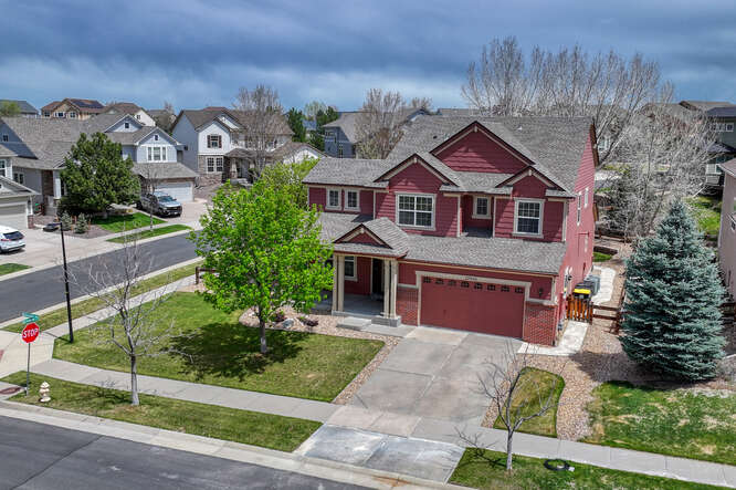 front elevation drone shot of home on corner lot in canterberry hoa