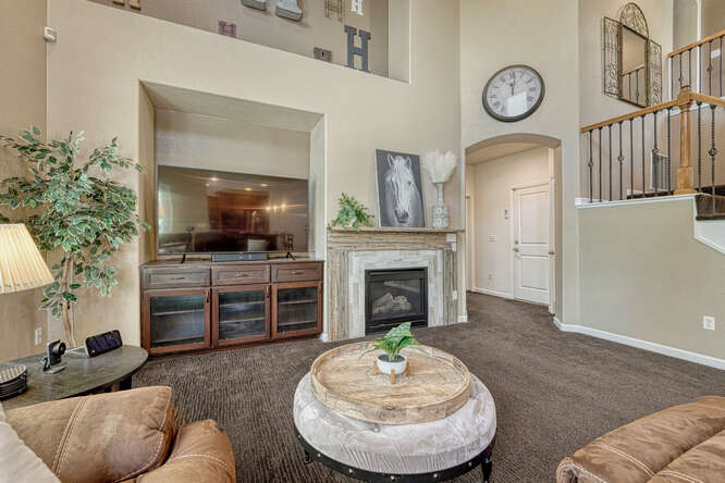 gas fireplace with custom tile surround and large built in area
