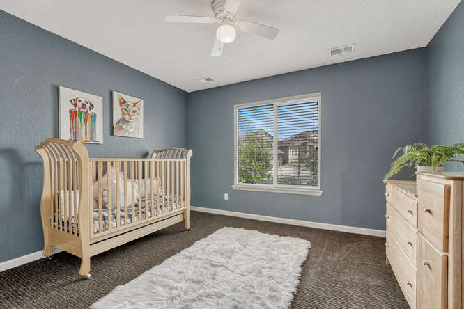 baby nursery bedroom with blue walls