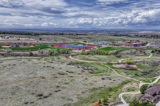 aerial view of legend high school practice blue football field in parker