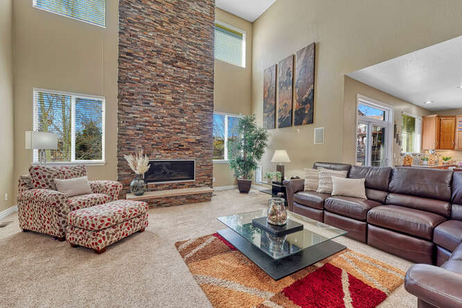 floor to ceiling stone fireplace with Colorado stone hearth