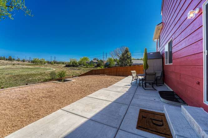 concrete patio running length of home