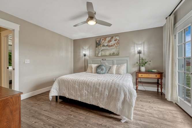 primary bedroom with wall sconces