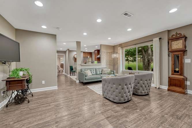 family room with LVP flooring in in-law suite